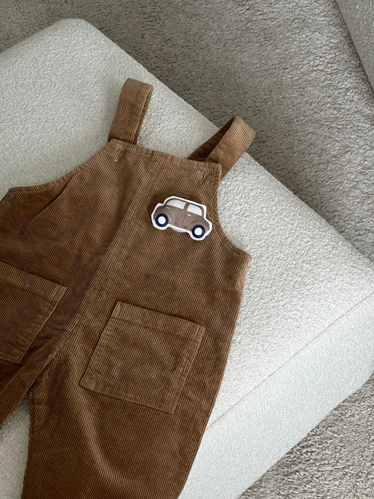 Brown jumpsuit and 2 changeable decorations